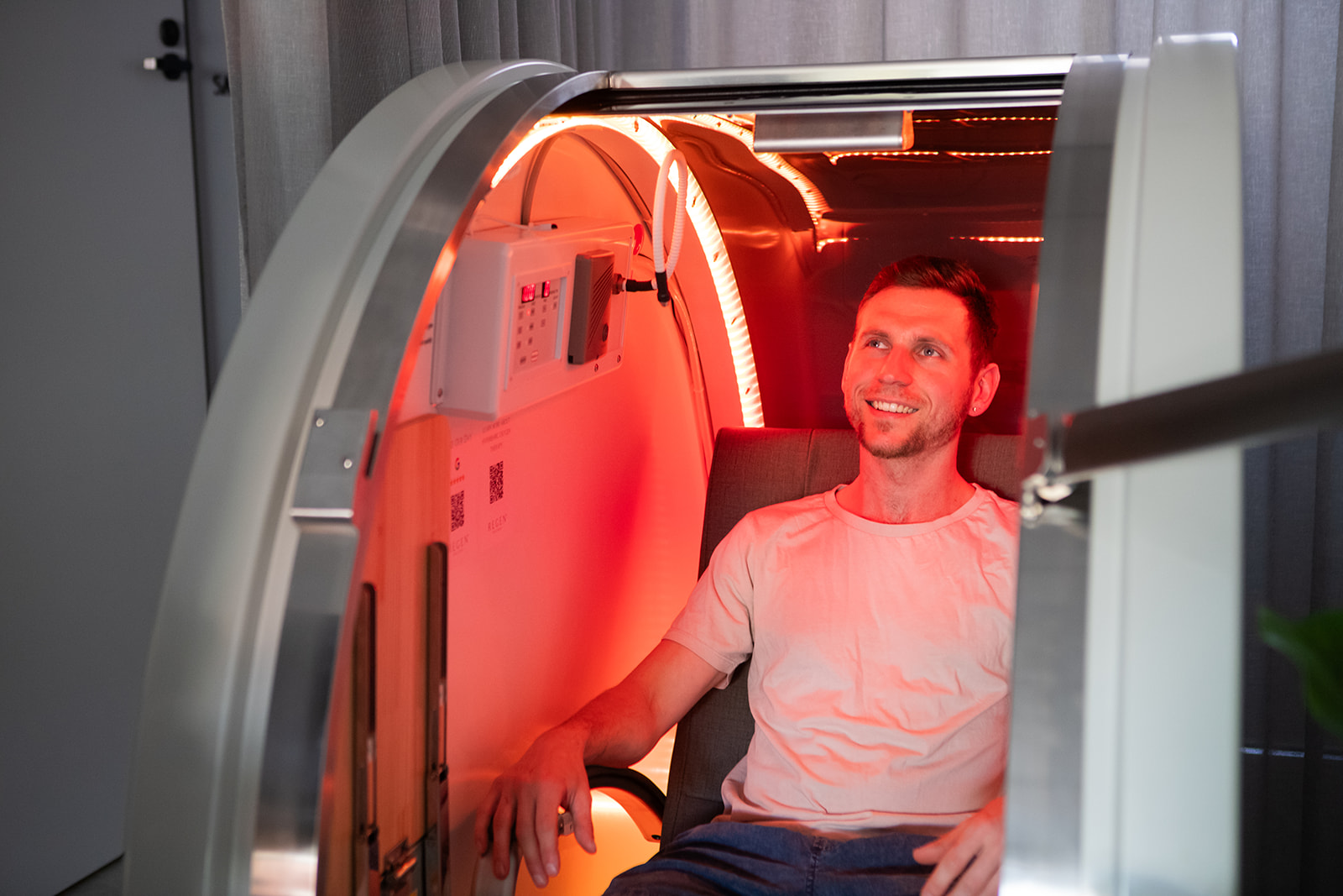 Man smiling in red light therapy
